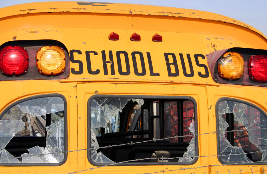 School bus with broken windows after crash